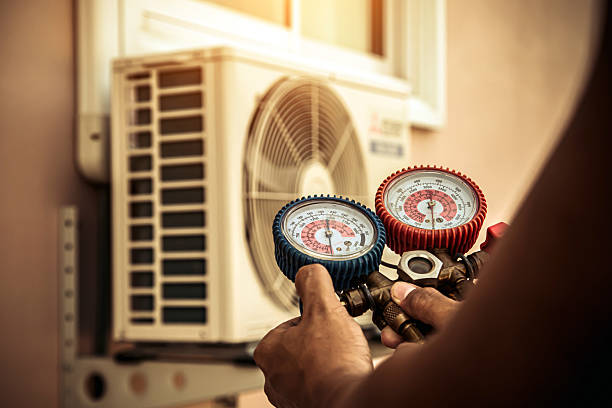 Professional Air Conditioning Service technician working in Forreston, IL